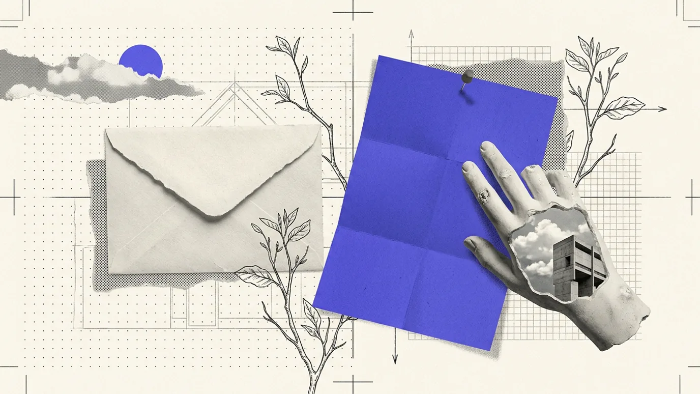 A sealed bone-white envelope lying on a dotted grid beside an unfolded sheet of solid blue paper, held down by a plaster hand with a cutout of sky and a building in it